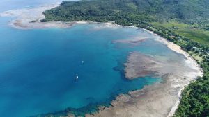 Aerial view of the anchorage on Aneityum island, Vanuatu showing yachts at anchor