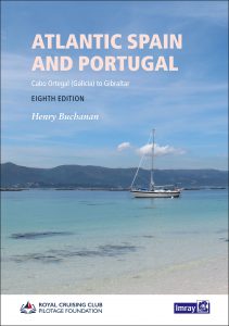 book cover for this cruising guide with a pic of an anchorage with mountains behind and a lone yacht at anchor