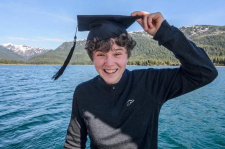 Girl with a graduation cap on her head.